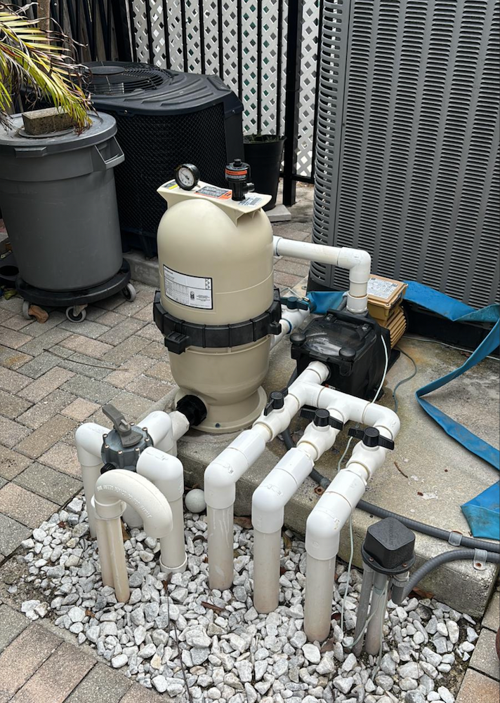 Brand new pool filter with clean white PVC plumbing after replacement